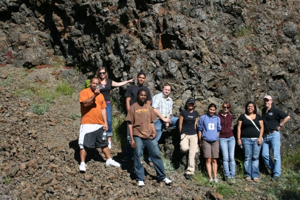 Students in front of rock outcrop